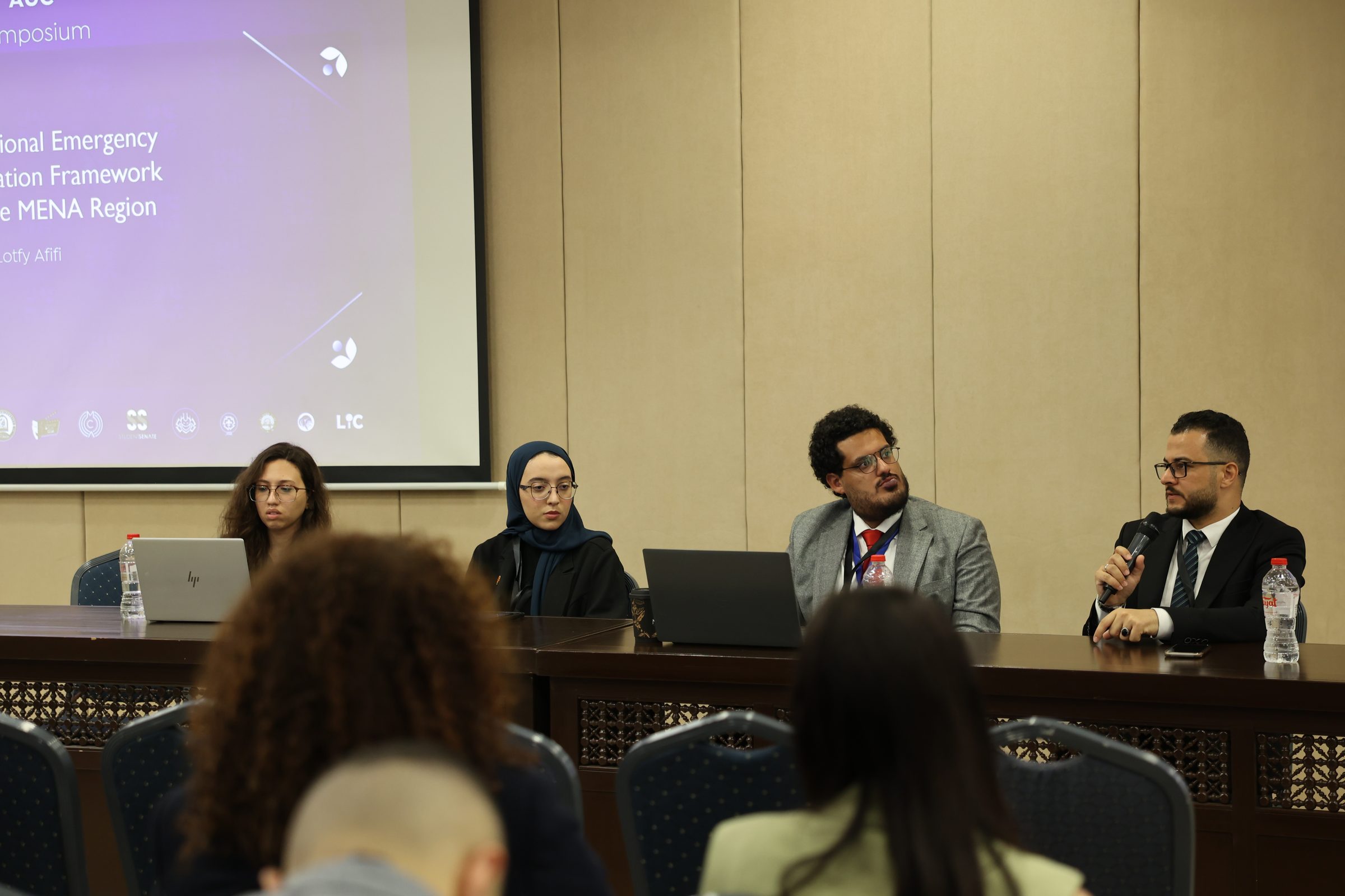 Panellists answering questions during an academic session of the symposium