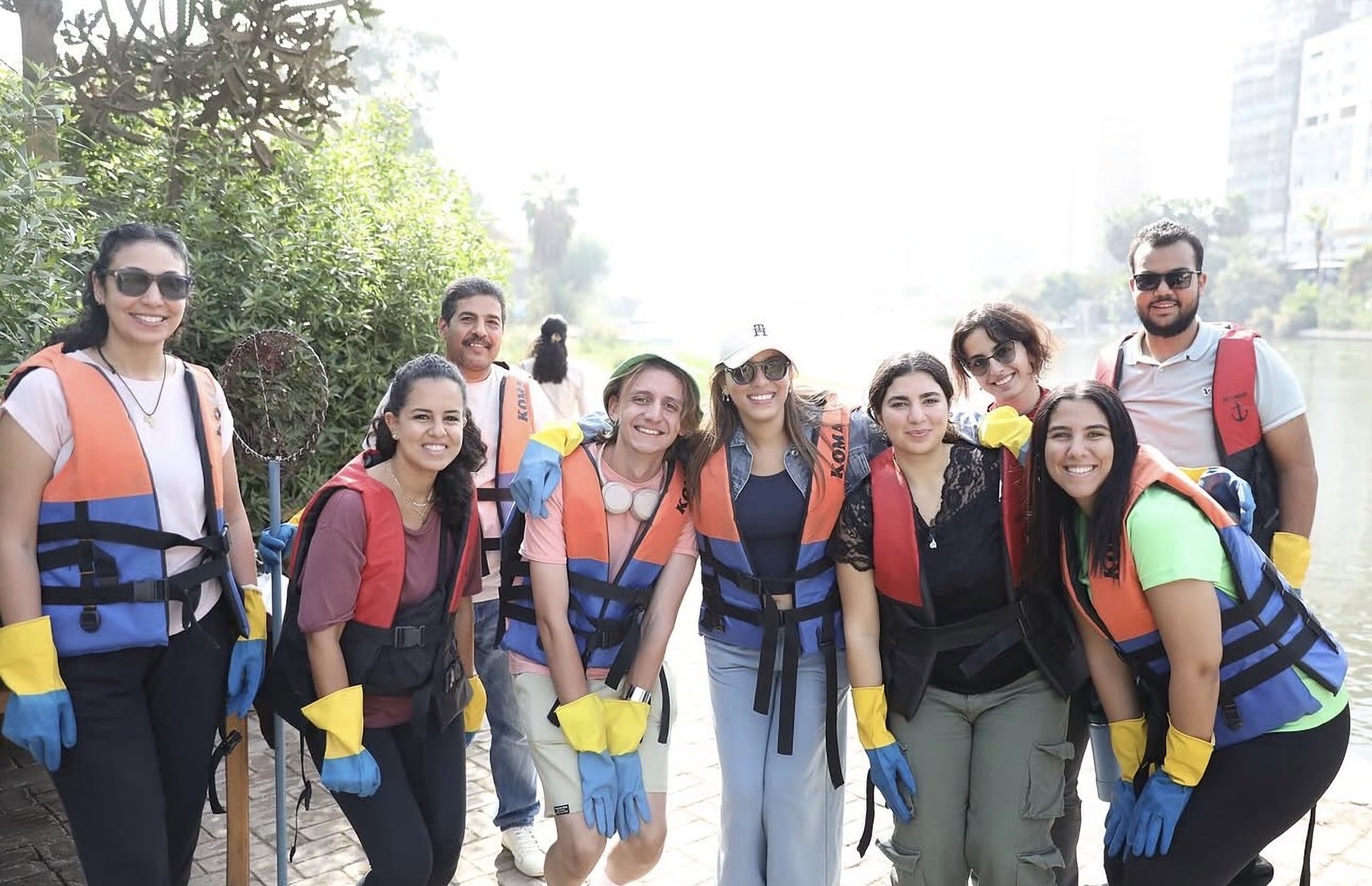 Scholars in life vests during a Nile clean-up